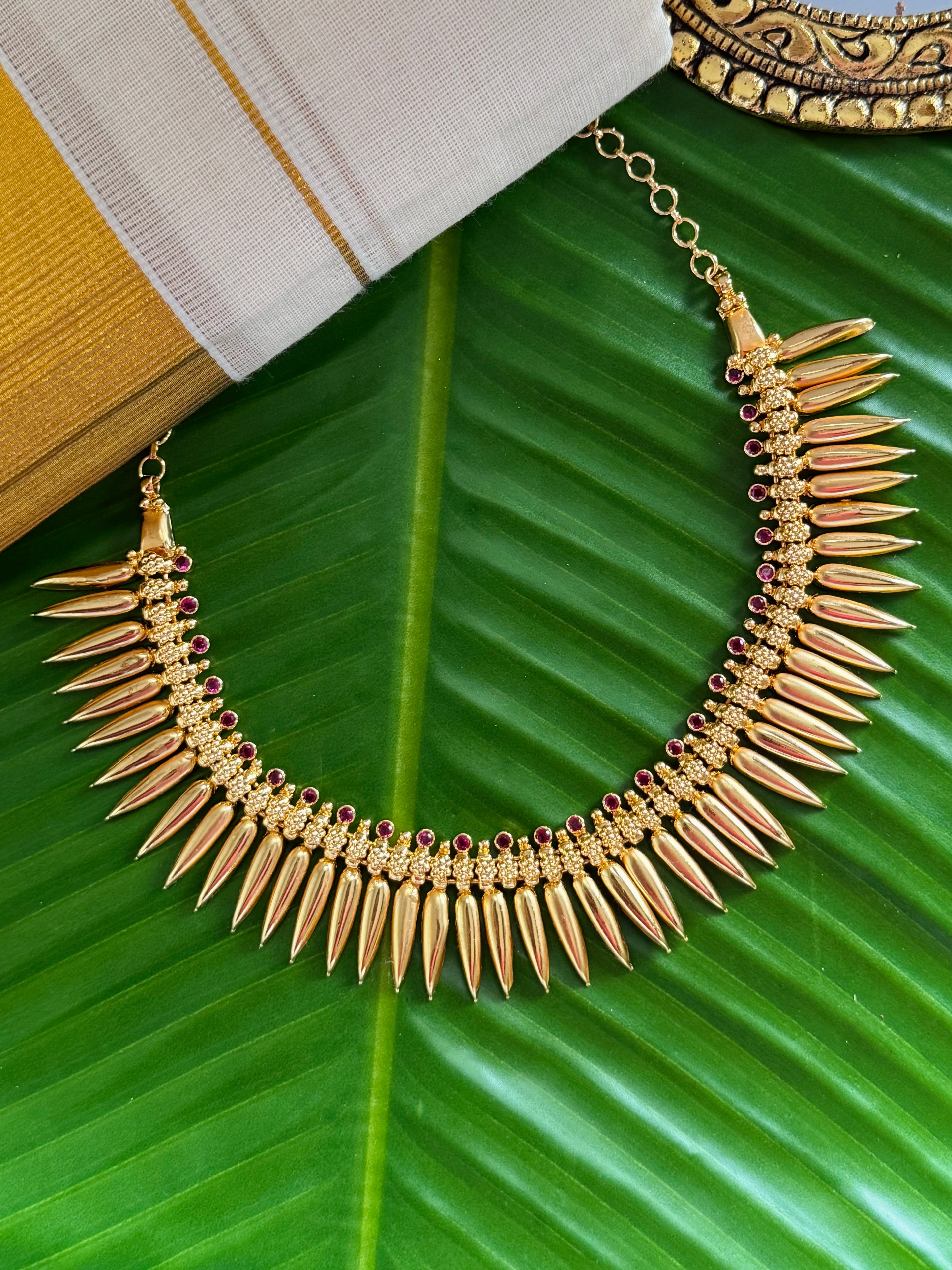 Mullamottu necklace with ruby stones