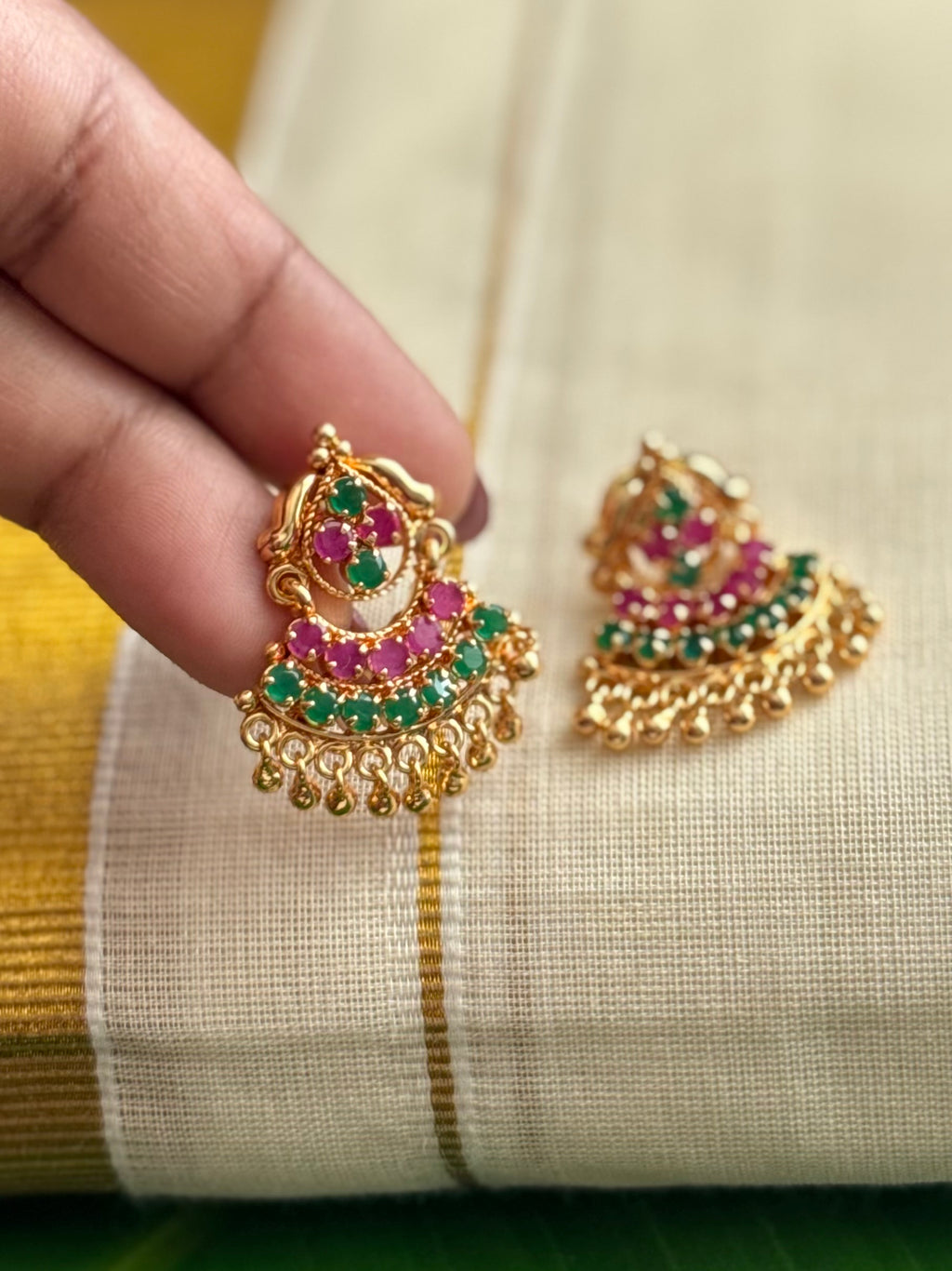 Ruby and emerald accent stone studs